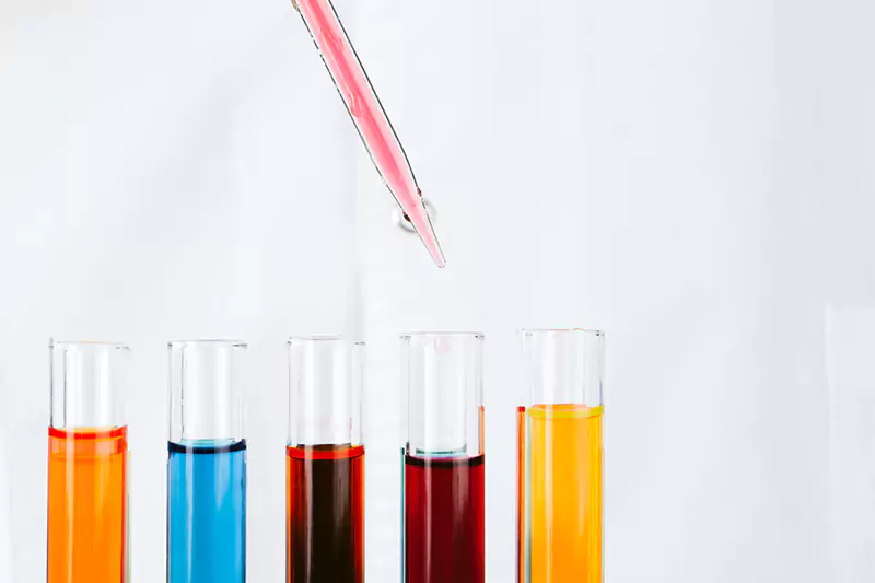 chemist-hands-holding-test-tubes-with-liquids-and-2021-10-11-20-47-52-utc-scaled