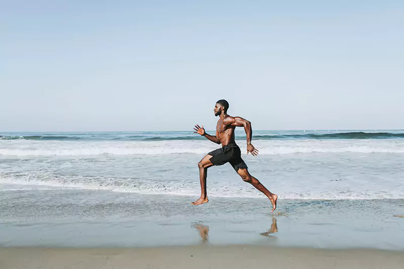 fit-man-running-at-the-beach-2022-02-22-22-48-25-utc-scaled