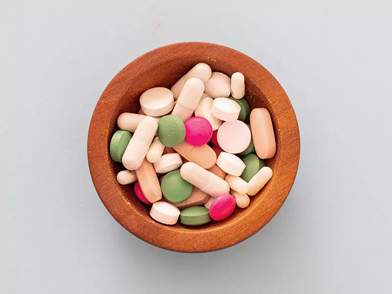 medicine-pills-and-capsules-on-pastel-blue-backgro-2021-08-27-21-35-41-utc-scaled-e1657246124967
